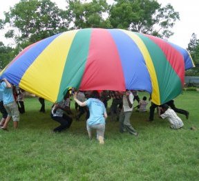 Playing with the parachute at Graces Childrens Home