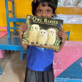 School girl with story book