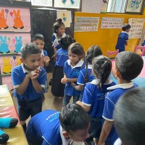School children listen to nursery rhymes